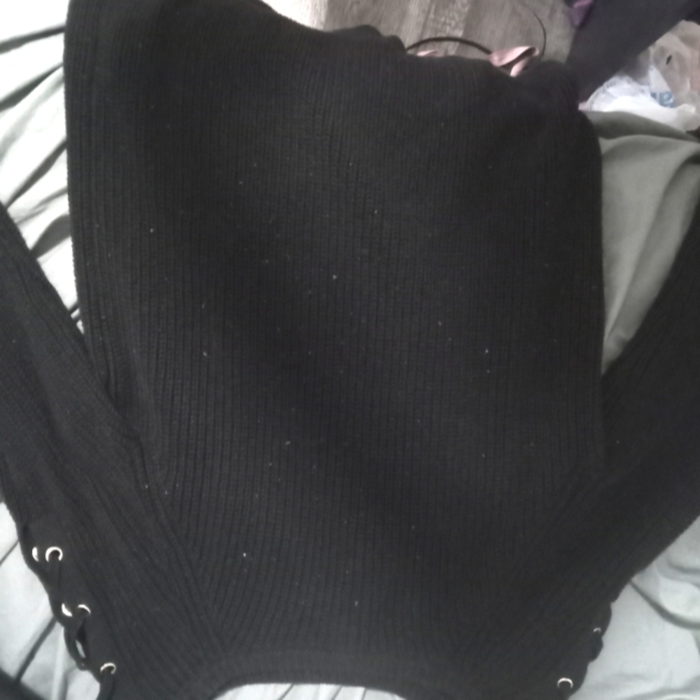 Long black knitted sweater with stitched shoulder details